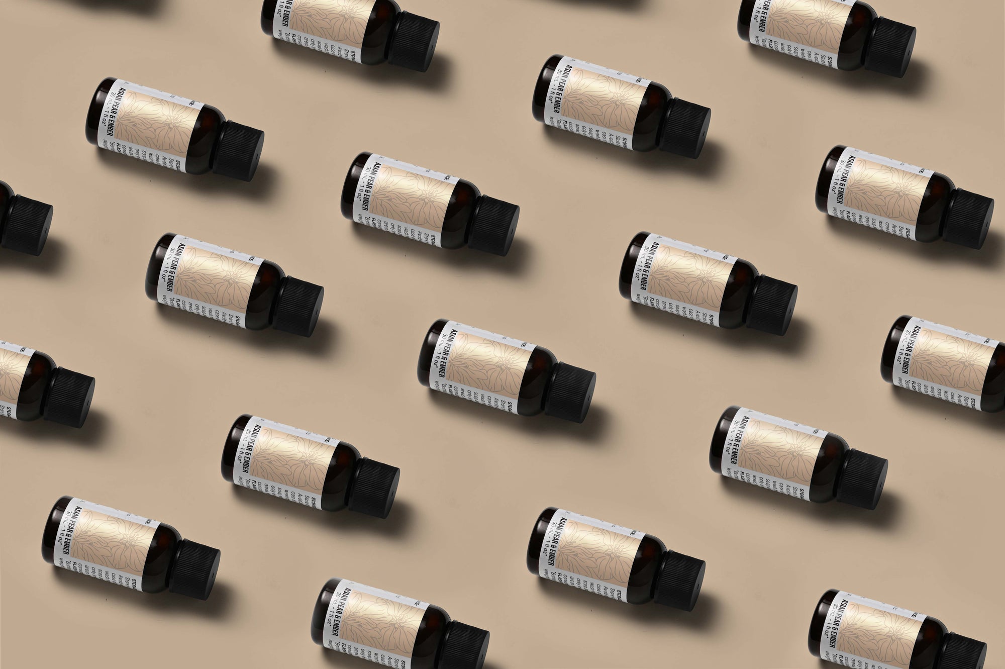 Pattern of Asian Pear & Ember fragrance oil bottles on a tan background