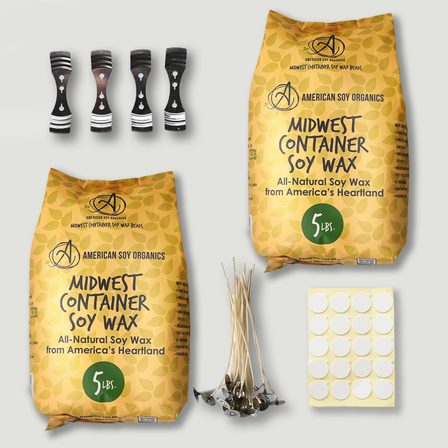 Two bags of Midwest Container Soy Wax, wicks, and labels on a light gray background