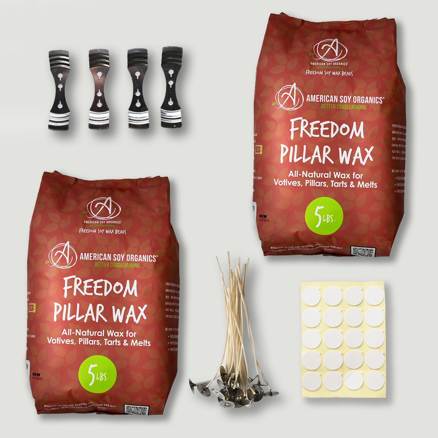American Soy Organics Freedom Pillar Wax packages with accessories on a light gray background
