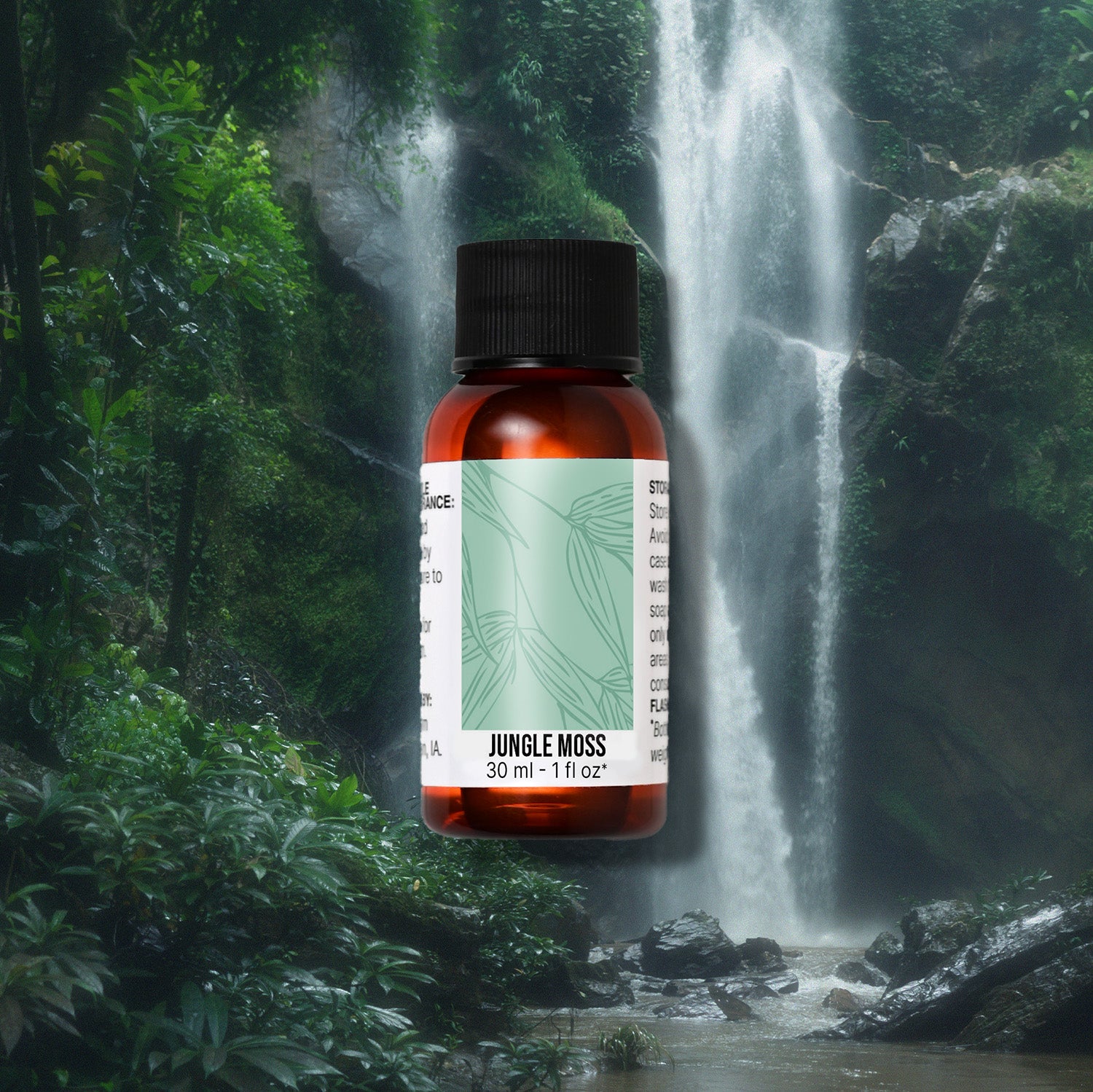 Bottle of 'Jungle Moss' fragrance oil with a waterfall and lush greenery in the background