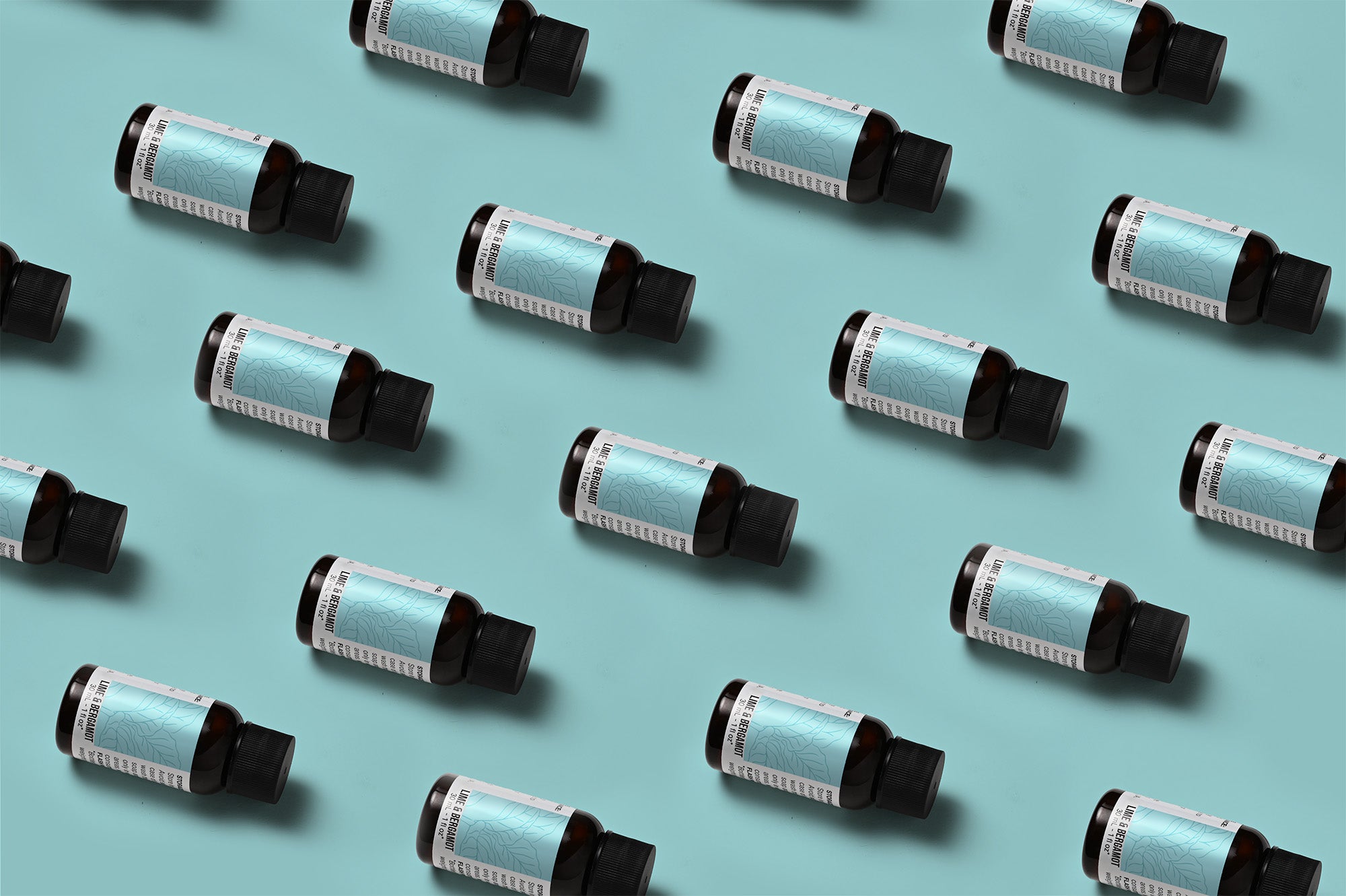 Pattern of Lime & Bergamot fragrance oil bottles on a light blue background