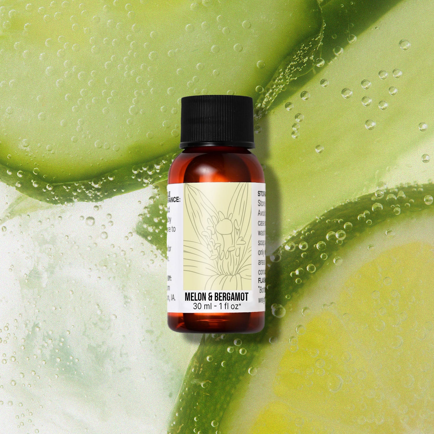 Bottle of melon and bergamot fragrance oil with a green fruit background
