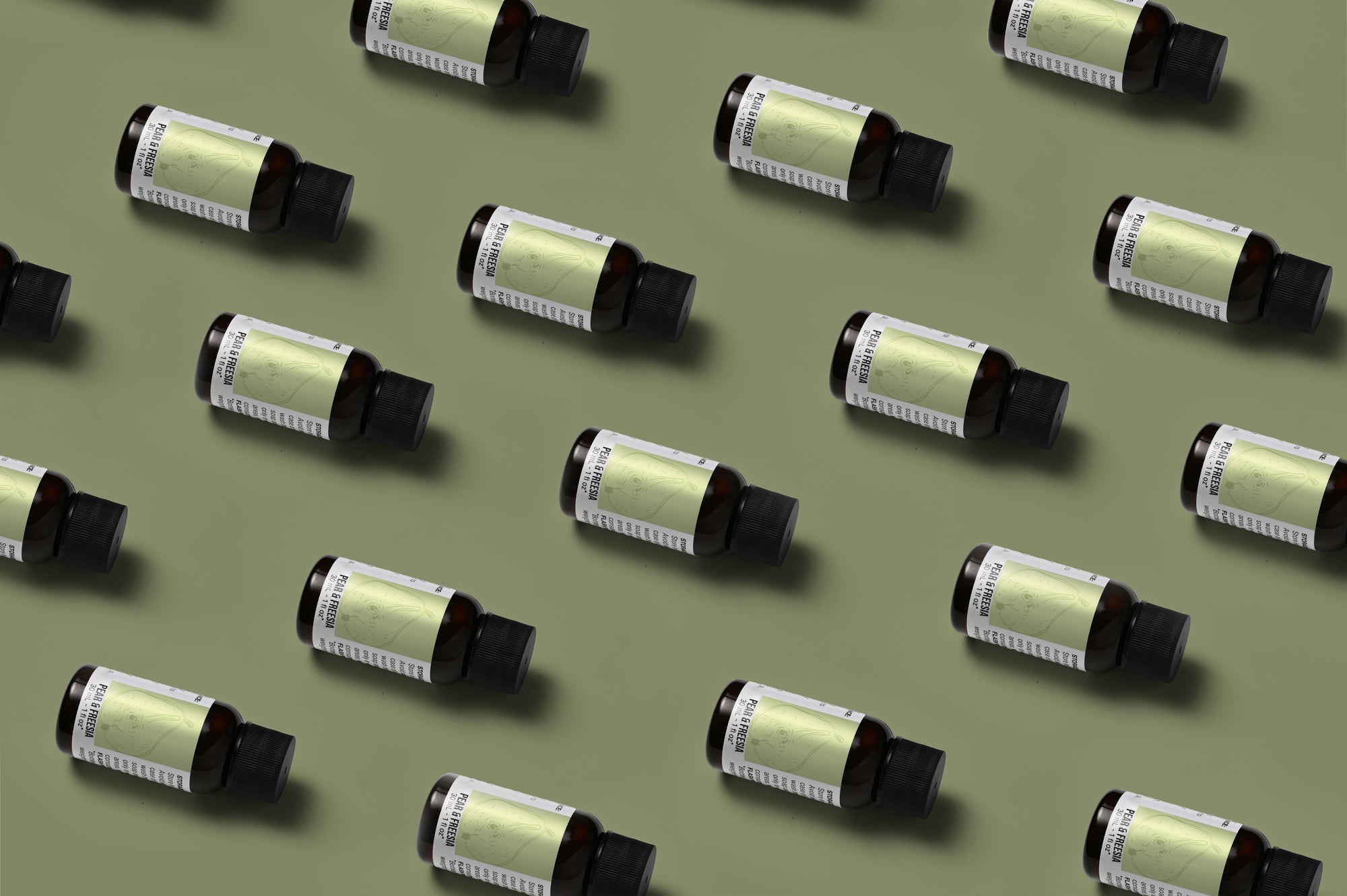 Pattern of Pear Freesia fragrance oil bottles on a light green background