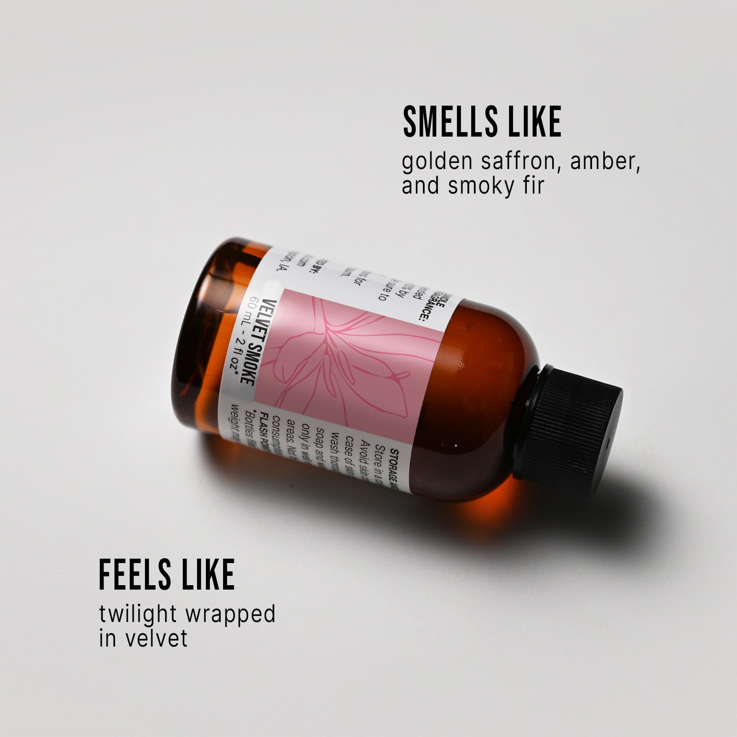 Bottle of Velvet Smoke fragrance oil with a label on a white background, describing its scent.