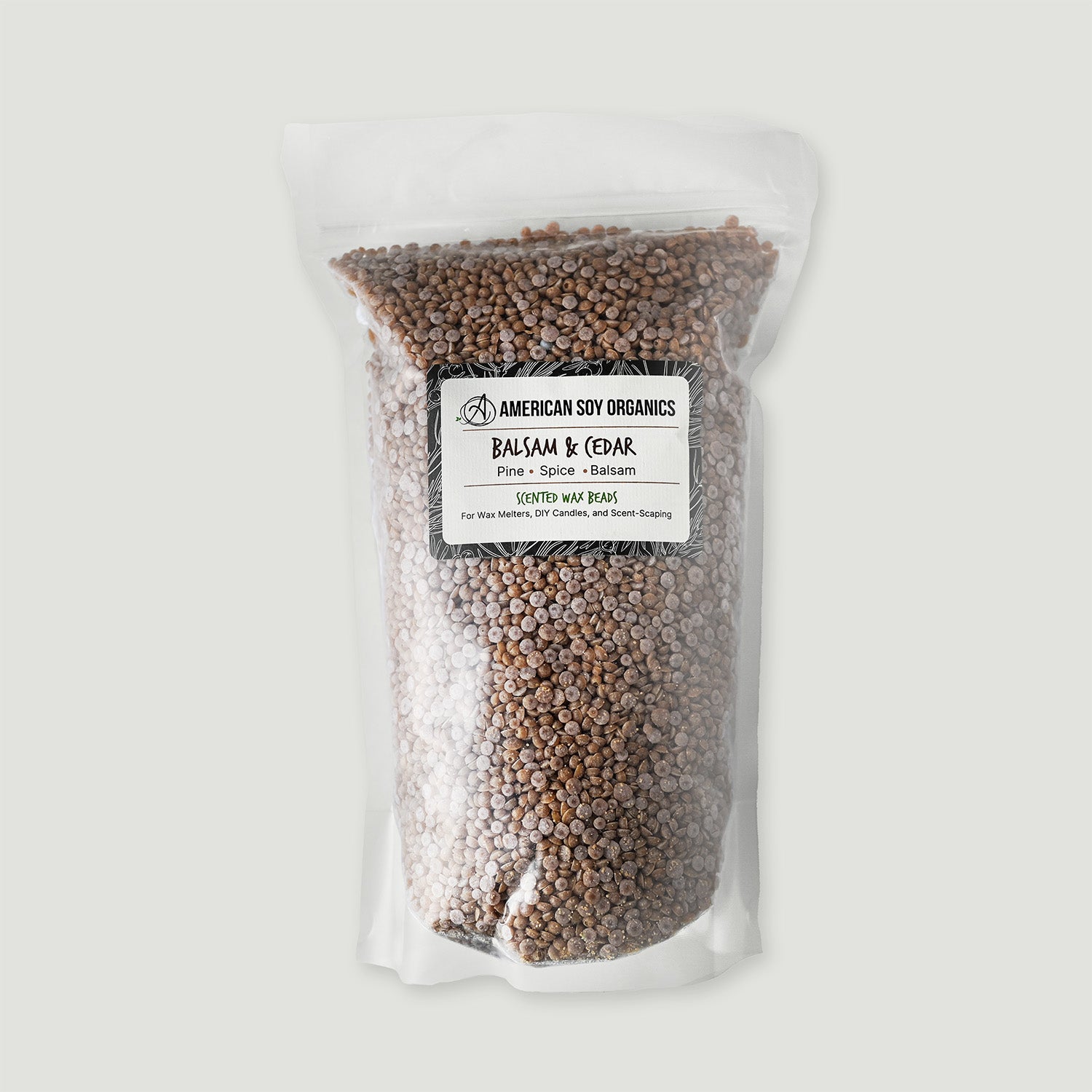 Bag of American Soy Organics Balsam & Cedar wax beads on a white background