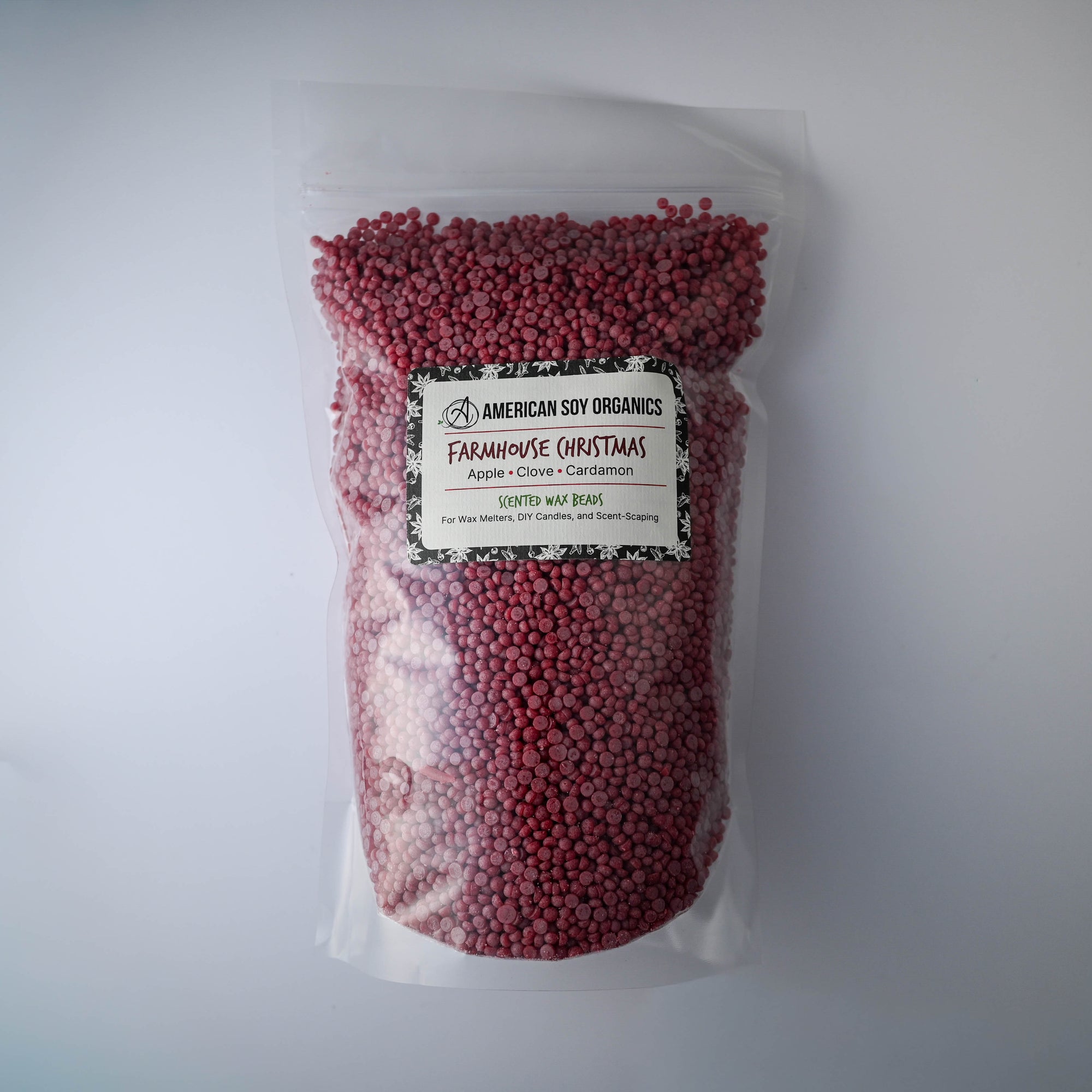 Bag of Farmhouse Christmas American Soy Organics scented wax beads on a white background