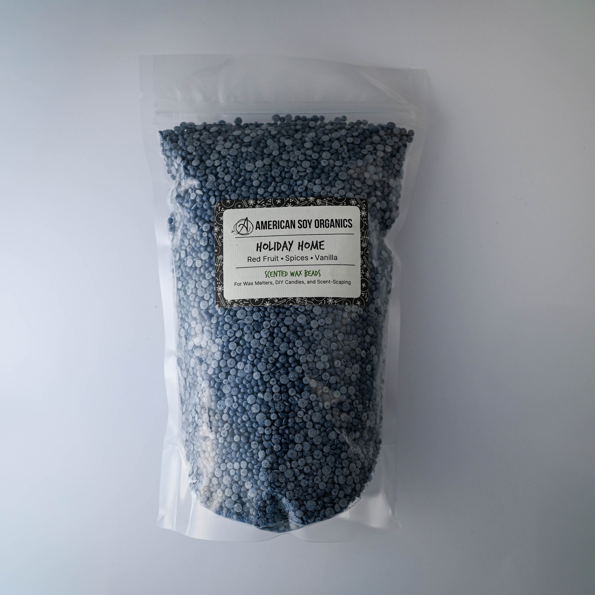 Bag of American Soy Organics Holiday Home wax beads on a white background