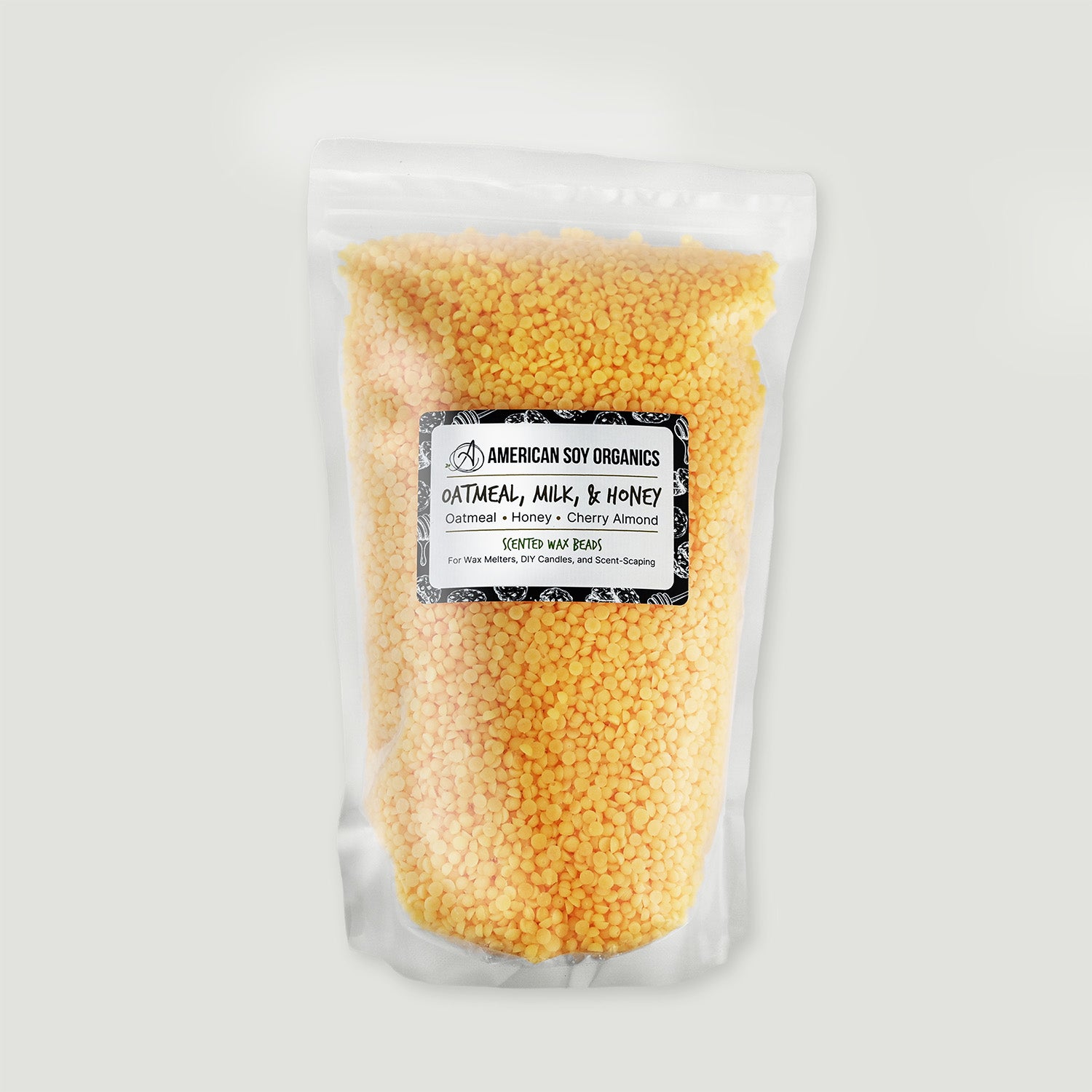 Bag of yellow pellets with an American Soy Organics label on a white background
