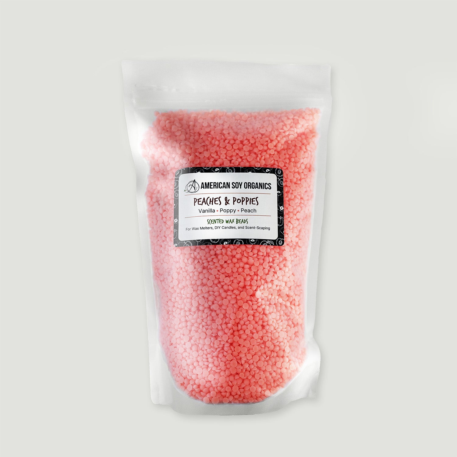 Bag of pink wax beads with a label on a white background