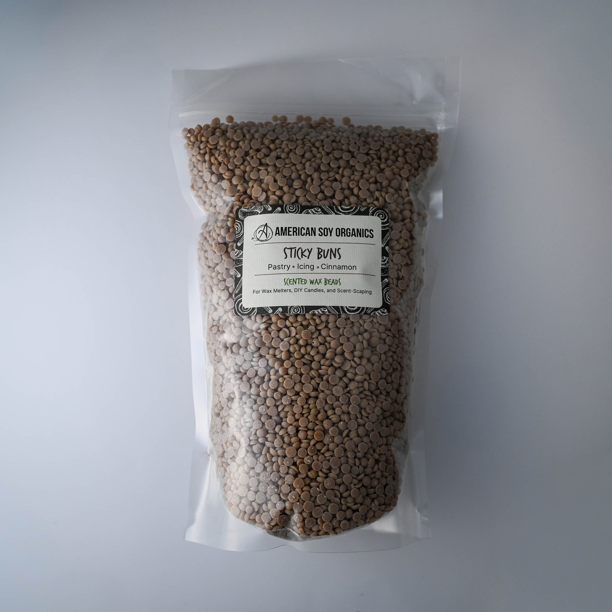Bag of Sticky Buns American Soy Organics scented soy wax beads on a white background