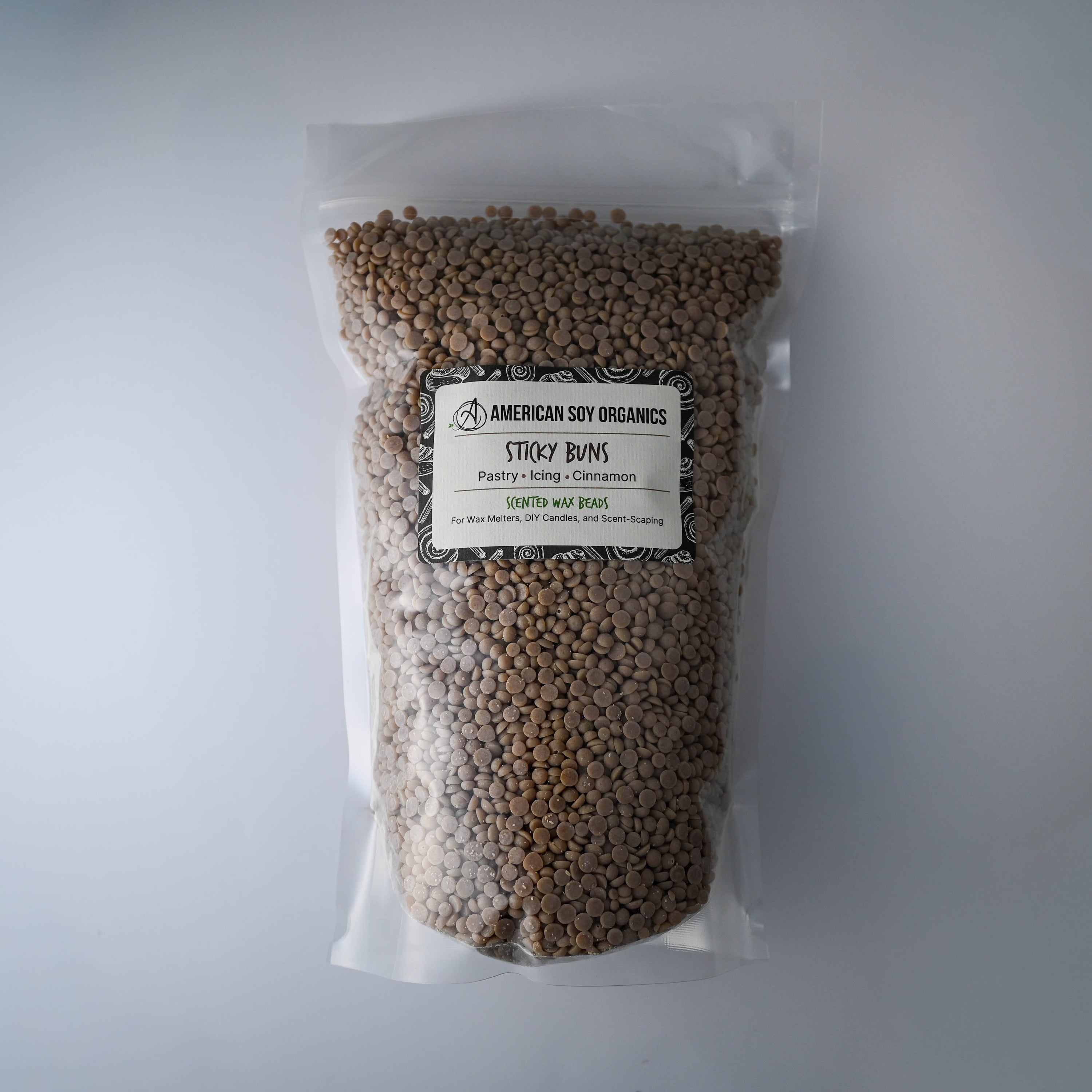 Bag of Sticky Buns American Soy Organics scented soy wax beads on a white background